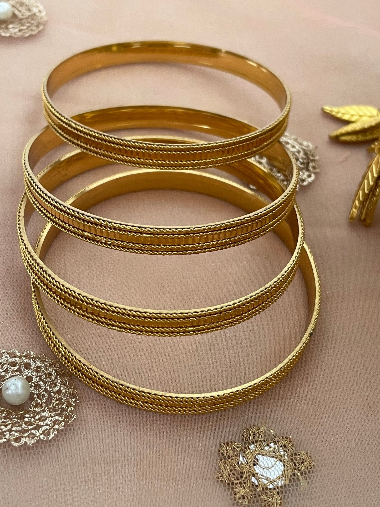 Set of four Solid Gold style Bangles With intricate border detailing Real jewellery style