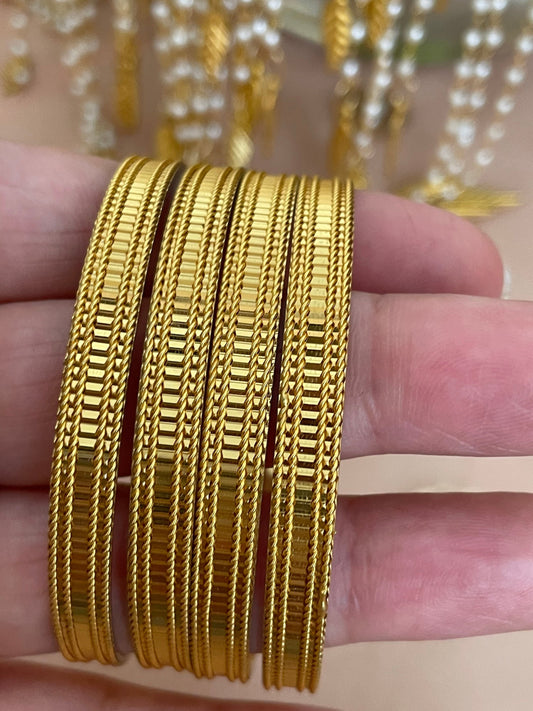 Set of four Solid Gold style Bangles With intricate border detailing Real jewellery style