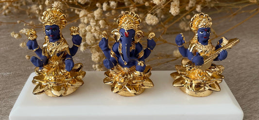 Trinity of Lakshmi Ganesh and Saraswati Figurines Murtis on a white pedestal Diwali Pooja Dhanteras Available in four finishes